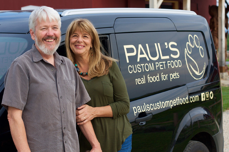 Paul Gallant & Lynn Felici-Gallant standing in front of a Paul's Custom Pet Food van.