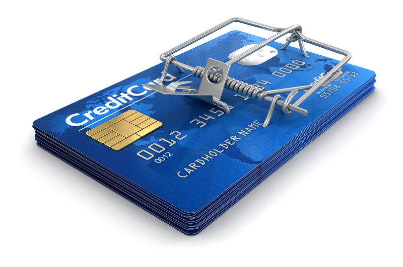 Credit card set in a mouse trap.
